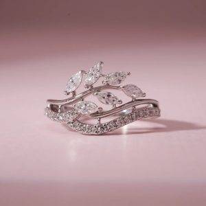 Elegant silver ring with marquise-cut diamonds arranged in a leaf-inspired design.