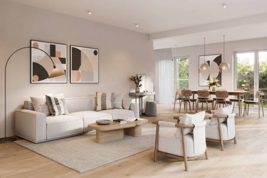 Spacious living room with a contemporary design, featuring a comfortable sofa, artwork, and a dining area.